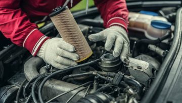 Mechanic Replaces Filter